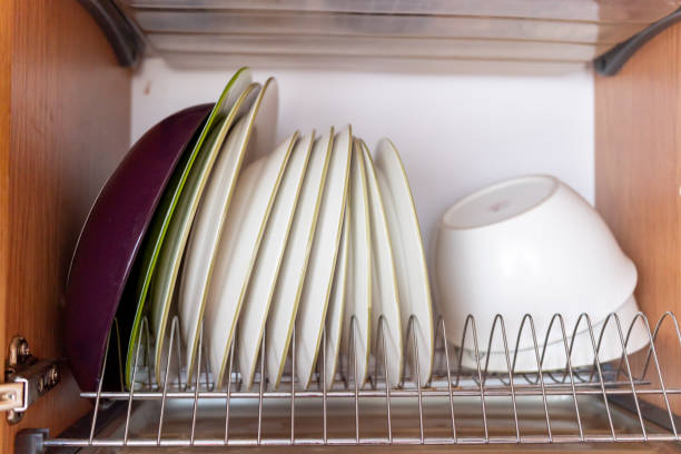 washed dishes in a cupboard close up