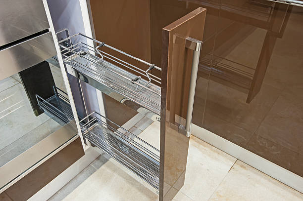 Small sliding cupboard shelf unit in a luxury kitchen interior