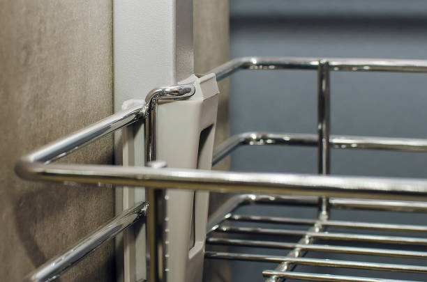 Roll out metal basket for kitchen furniture. Fashionable interior.